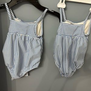 never used two one piece bathing suits for girls size 24months